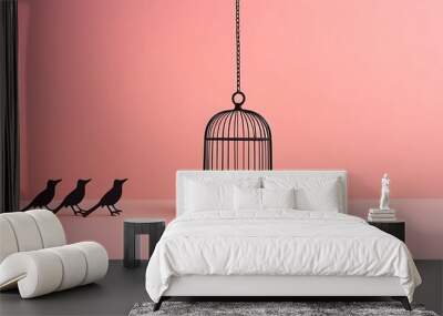 A creative minimalistic concept featuring a birdcage with witches' silhouettes against a pastel pink background, capturing a Halloween scary vibe with a modern aesthetic and plenty of copy space Wall mural