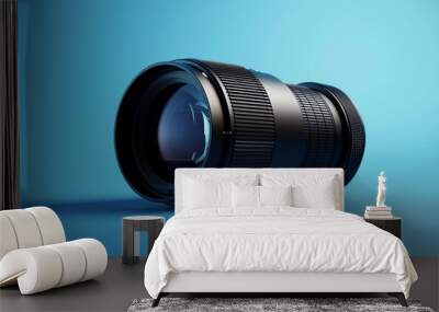 A black camera lens on a blue background. Wall mural