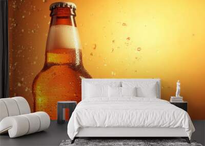 A bottle of beer with condensation on an orange background. Wall mural