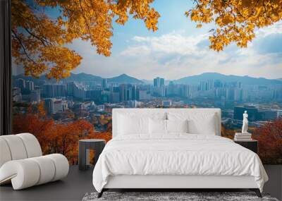 A city skyline viewed through autumn-colored trees. Wall mural