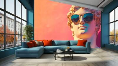 A classical statue wearing sunglasses, set against a pink background. Wall mural