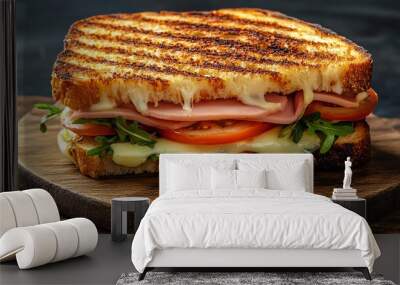 A grilled ham and cheese sandwich with tomato and lettuce. Wall mural