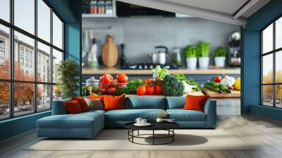 A kitchen counter with fresh produce, including tomatoes, broccoli, and herbs. Wall mural