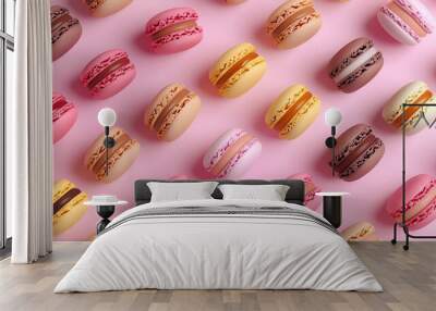 A pattern of colorful macarons on a pink background. Wall mural