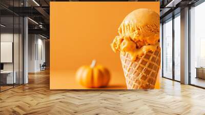 A pumpkin-flavored ice cream cone with pumpkins in the background. Wall mural