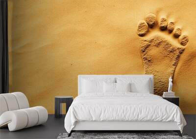 A single footprint in soft sand. Wall mural