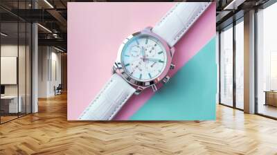 A white wristwatch with a white leather strap on a pink and blue background. Wall mural