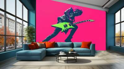 An energetic guitarist with a green guitar is jumping in the air and playing a guitar. The guitarist is wearing a black jacket and black pants. Wall mural