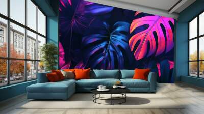 Tropical leaves in a neon pink and blue glow. Wall mural