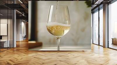 Wine being poured into a glass. Wall mural