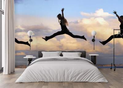 leaping woman at sunset Wall mural