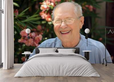 old man laughing in his garden Wall mural