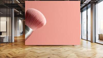 Cosmetic brush for applying blush on a pastel pink background. Banner with free space for text. Generated by AI Wall mural