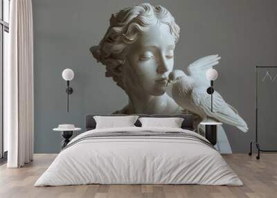 Elegant sculpture of a woman holding a dove Wall mural