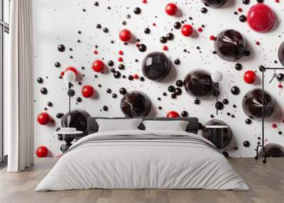 Red And Black Candy Scattered On White Wall mural