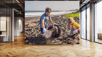 dad and son are cleaning up the beach. natural education of children Wall mural