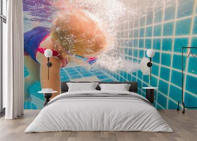 Girl and under water pool working drain close up Wall mural