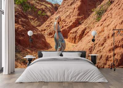 Woman tourist in red canyon, resumption of tourism concept Wall mural