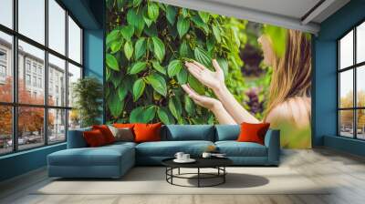 Young woman on a black pepper farm in Vietnam, Phu Quoc Wall mural