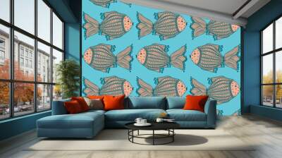 Group of fish swimming in two directions Wall mural