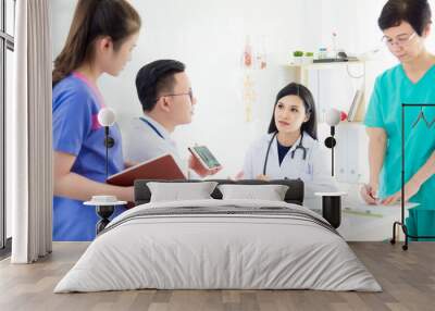 Asian Medical team,doctor meeting with nurse in office.Hospital health care teamwork concept.. Wall mural