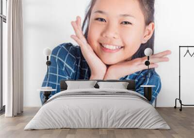 Cute teenager asian girl smiling over white background Wall mural