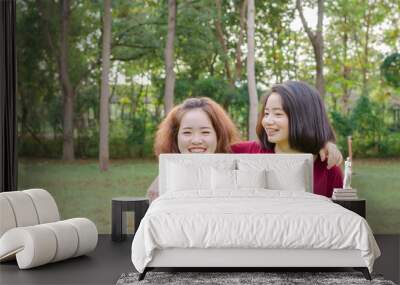 Two young Asian woman smile after excercise together Wall mural