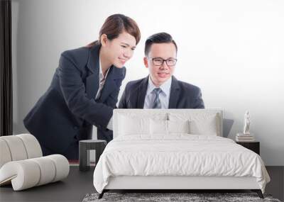 Young asian businessman and businesswoman discussing about work over white background Wall mural