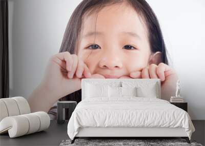 Young Asian girl child showing silver amalgam tooth sealant over white background Wall mural