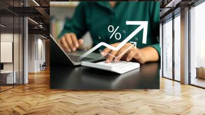 Interest rate concept, Business man using calculator with graph percentage symbol and up arrow, Growth of investments and profits, Dividends and long term investing to win Inflation, Calculate taxes. Wall mural