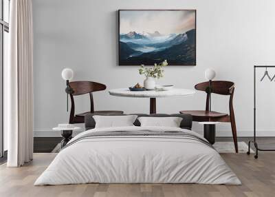 A framed wall art mockup in an elegant dining room, featuring two dark wood chairs around the table and a marble-topped surface. The artwork hangs on the white walls above the round wooden base. Wall mural