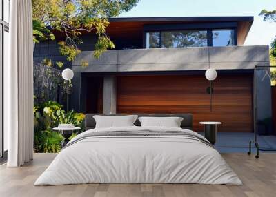 A modern house with a wooden garage door and concrete walls, a concrete modern-style home exterior design in the Australian style, and modern architecture with dark brown wood. Wall mural