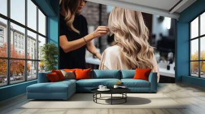 Professional hairdresser working with a client in the beauty salon. Blonde girl getting ready for work. Back view of girl with long hair Wall mural