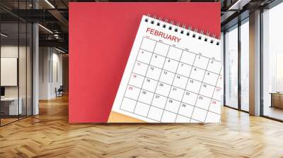 February 2024 desk calendar on red color. Wall mural