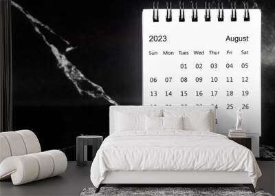 The August 2023 Monthly desk calendar for 2023 year on black marble background. Wall mural