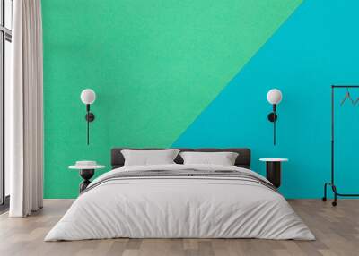 Background of two sheets of colored paper, green and blue. Wall mural