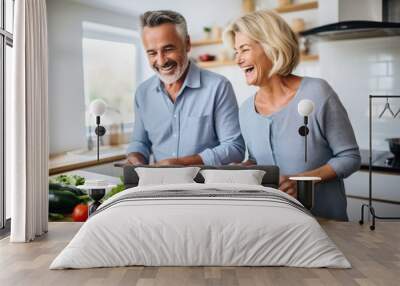 mature couple cooking in kitchen, using recipe from mobile app on phone Wall mural