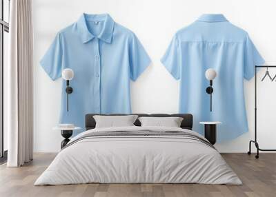 Two light blue short-sleeve shirts on white background Wall mural