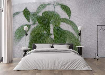 Air bubble wrapped flowerpot. Copy space.  Wall mural