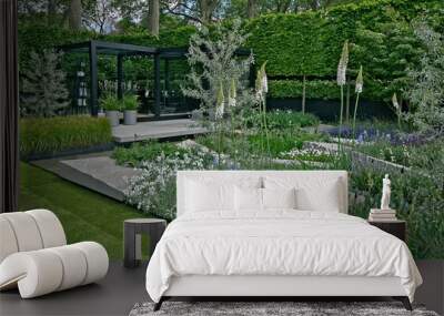 A modern Cool Scandinavian stylish  garden design with flowers and shrubs Wall mural