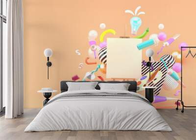 Frame drawing surrounded by colored tubes, palette, crayon, paint rollers and bulbs on an orange background.-3d rendering. Wall mural