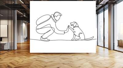 Man high-fiving dog in continuous line art drawing style. Pet and people friendship. Black linear sketch isolated on white background. Vector illustration Wall mural