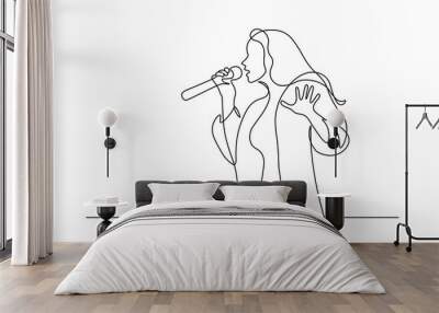 Singer in continuous line art drawing style. Young woman holding microphone and singing. Black linear sketch isolated on white background. Vector illustration Wall mural