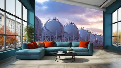 Gas storage tanks at sunset. Wall mural