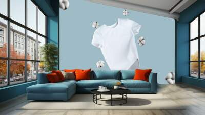 White flying cotton T-shirt isolated on blue background. Clean white t-shirt for women or men. Unisex. cotton flowers. Branding clothes front view. Mock up for your design. Classic White Basic T-shirt Wall mural