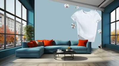 White flying cotton T-shirt isolated on blue background. Clean white t-shirt for women or men. Unisex. cotton flowers. Branding clothes front view. Mock up for your design. Classic White Basic T-shirt Wall mural