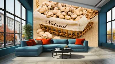 close-up of pistachio nuts in the basket. Wall mural