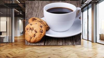 Cup of coffee with cookies on a wooden table. Wall mural