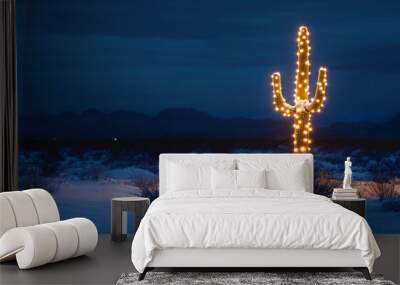 A saguaro cactus with white Christmas tree lights in the desert at night after a snowstorm Wall mural