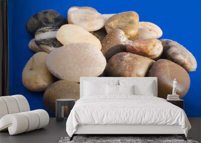 wet stones on blue background Wall mural